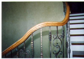 iron balusters with red oak handrail